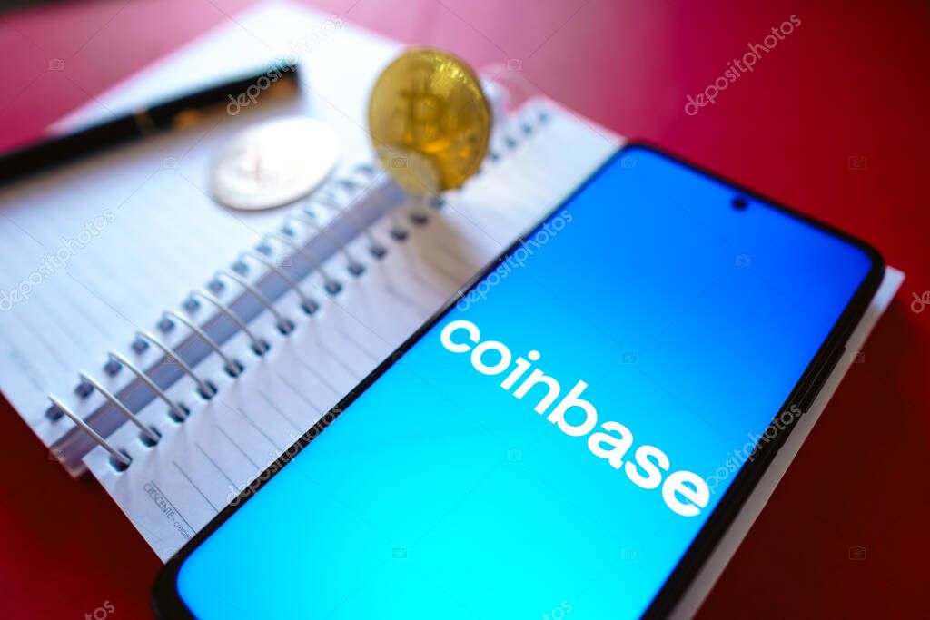 July 19, 2022, Brazil. In this photo illustration the Coinbase logo seen displayed on a smartphone screen, on the side of Bitcoin cryptocurrencies