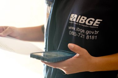 August 1, 2022, Brazil. In this photo illustration, the IBGE (Instituto Brasileiro de Geografia e Estatstica) census taker working on the Census in Brazil.