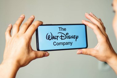 August 5, 2022, Brazil. In this photo illustration, the Walt Disney Company logo is displayed on a smartphone screen