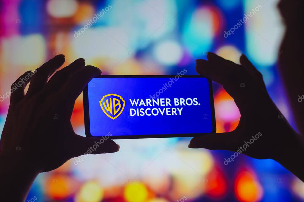 August 5, 2022, Brazil. In this photo illustration, the Warner Bros. Discovery logo is displayed on a smartphone screen