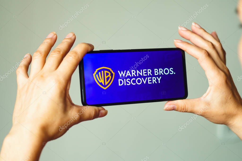 August 5, 2022, Brazil. In this photo illustration, the Warner Bros. Discovery logo is displayed on a smartphone screen