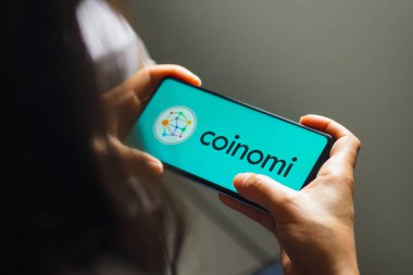 August 8, 2022, Brazil. In this photo illustration, the Coinomi logo is displayed on a smartphone screen