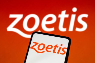 August 16, 2022, Brazil. In this photo illustration, the Zoetis logo is displayed on a smartphone screen and in the background