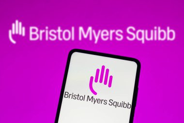August 16, 2022, Brazil. In this photo illustration, the Bristol-Myers Squibb (BMS) logo is displayed on a smartphone screen and in the background