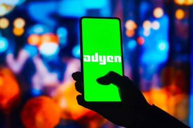 August 22, 2022, Brazil. In this photo illustration, the Adyen logo is displayed on a smartphone screen