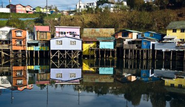 Palafito houses above the water in Castro, Chiloe, Chile clipart