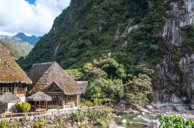 Aguas Calientes, the town at the foot of the sacred Machu Picchu clipart