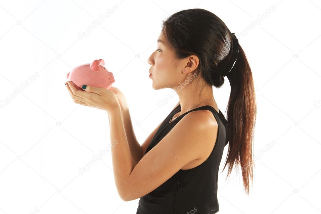 Asian Woman Kissing Piggy Bank