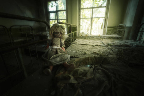 Chernobyl, Ukraine - Aug 06, 2019: Abandoned doll at Kindergarten  - Kopachi Village, Chernobyl Exclusion Zone, Ukraine