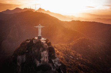 Rio de Janeiro, Brazil - May 3, 2022: Christ the Redeemer Statue on top of Corcovado Mountain at sunset - Rio de Janeiro, Brazil