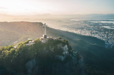 Rio de Janeiro, Brazil - May 3, 2022: Aerial view of Christ the Redeemer Statue on top of Corcovado Mountain and downtown Rio - Rio de Janeiro, Brazil