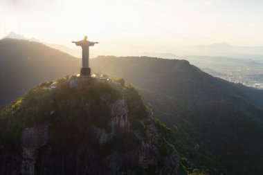 Rio de Janeiro, Brazil - May 3, 2022: Christ the Redeemer Statue on top of Corcovado Mountain at sunset - Rio de Janeiro, Brazil