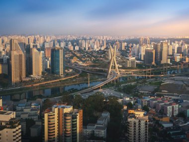 Aerial view of Octavio Frias de Oliveira Bridge (Ponte Estaiada) over Pinheiros River at sunset - Sao Paulo, Brazil