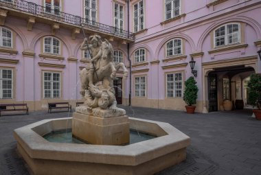 Bratislava, Slovakia - Oct 14, 2019: Fountain of St. George and the Dragon at Primate's Palace Courtyard (from Mid-17th century) - Bratislava, Slovakia