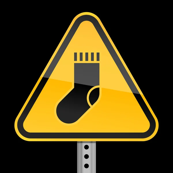 Señal de advertencia amarilla con símbolo de calcetín sobre fondo negro — Vector de stock