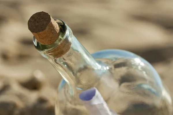 Found a bottle with a message near the shore Stock Picture