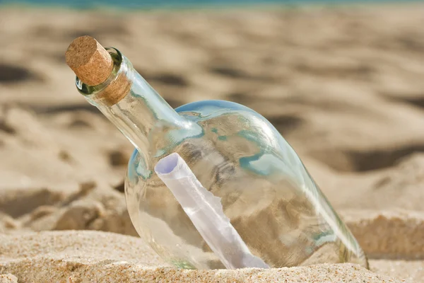 Found a bottle with a message near the shore Royalty Free Stock Images