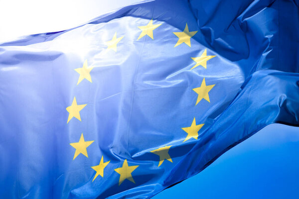 Material flag of European Union, sky in background