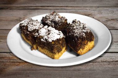 Four pieces of cake on a table