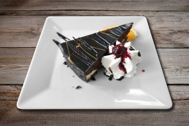 Slice of chocolate cake with whipped cream