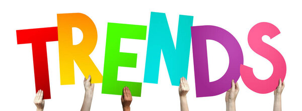 Trends - human hands holding colorful letters