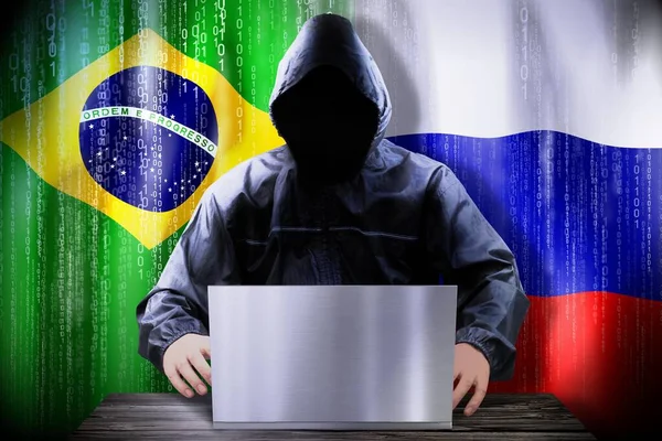 Hacker Anónimo Trabajando Una Computadora Portátil Banderas Brasil Rusia —  Fotos de Stock