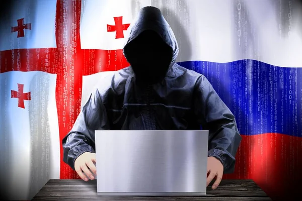 Hacker Anónimo Trabajando Una Computadora Portátil Banderas Georgia Rusia —  Fotos de Stock