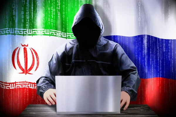 Hacker Anónimo Trabajando Una Computadora Portátil Banderas Irán Rusia —  Fotos de Stock