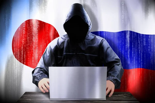 Hacker Anónimo Trabajando Una Computadora Portátil Banderas Japón Rusia —  Fotos de Stock