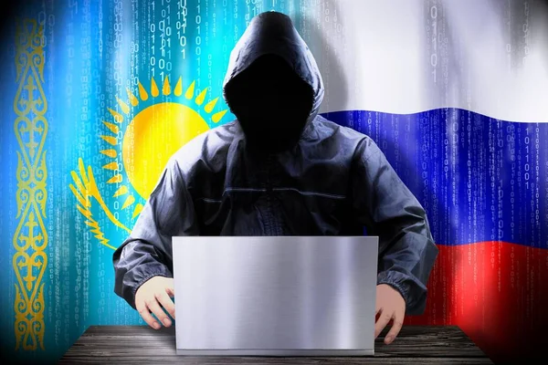 Hacker Anónimo Trabajando Una Computadora Portátil Banderas Kazajstán Rusia —  Fotos de Stock