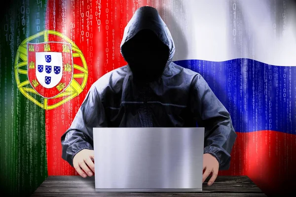 Anonymous Hacker Working Laptop Flags Portugal Russia — Stock Photo, Image