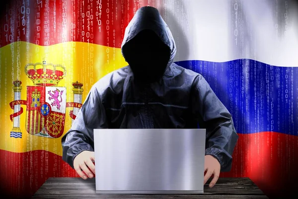Hacker Anónimo Trabajando Una Computadora Portátil Banderas España Rusia —  Fotos de Stock