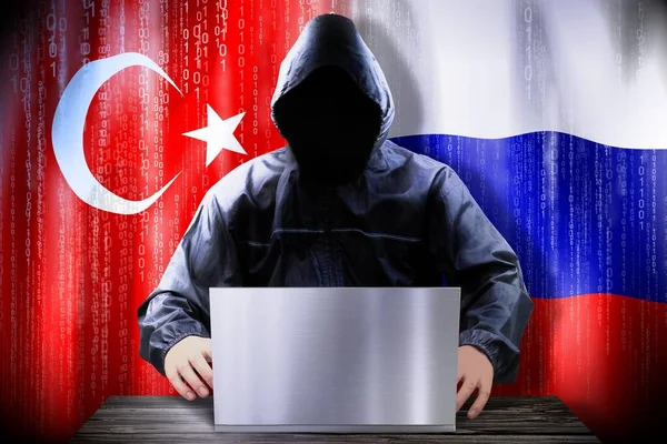 Anonymous Hacker Working Laptop Flags Turkey Russia — Stock Photo, Image