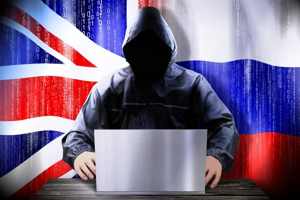 Hacker Anónimo Trabajando Una Computadora Portátil Banderas Reino Unido Rusia —  Fotos de Stock