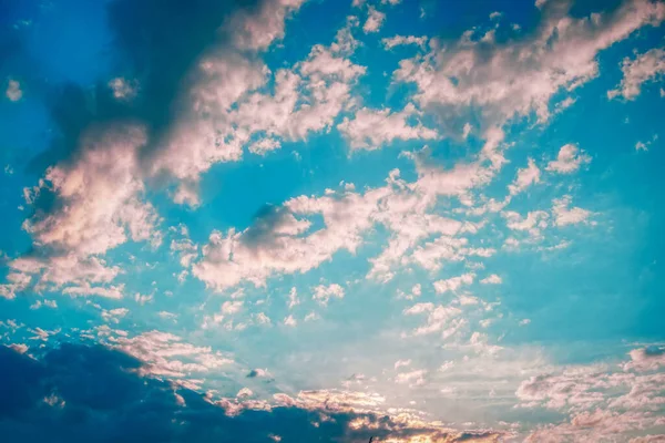 Multicolor clouds at sunset - dramatic sky