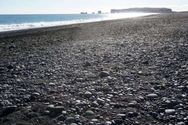 Pebbles on Reynisfjara Black Beach in Iceland
