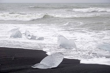 Diamond Beach in Iceland - black sand volcanic beach with iceberg chunks