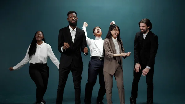 Young guys in classic costumes celebrate the finishing successful work project Royalty Free Stock Photos