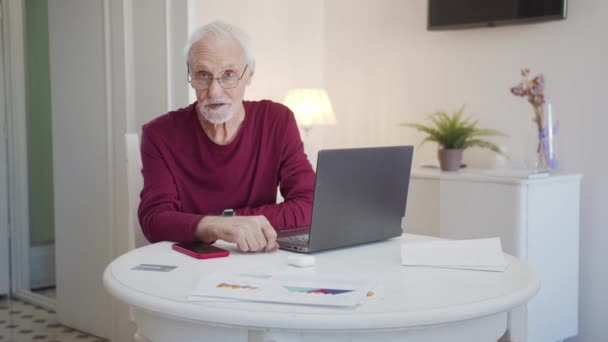Pensioner Sits Table Spacious Living Room Man Glasses Talks Development — Stock Video