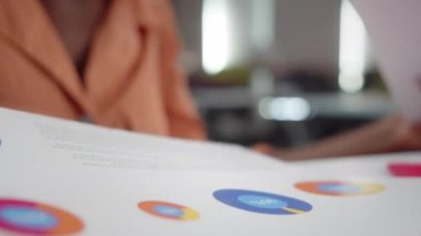 An african professor is checking her students homework close up. High quality 4k footage