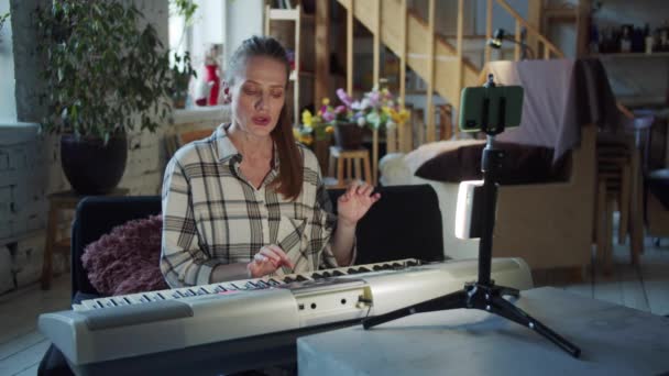 Music Teacher Conducts Distance Lesson She Sitting Electronic Piano Front — Stock Video