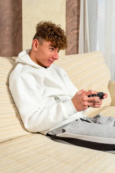 Caucasian Young Man Curly Hair Dressed Sportswear Sitting Sofa Home — Stock Photo, Image