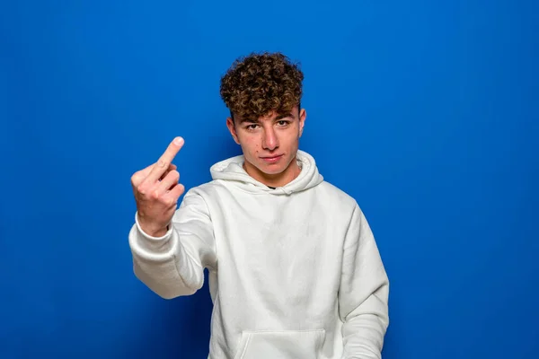 Young Spanish Man Wearing White Sweatshirt Curly Hair Standing Isolated — Stock fotografie