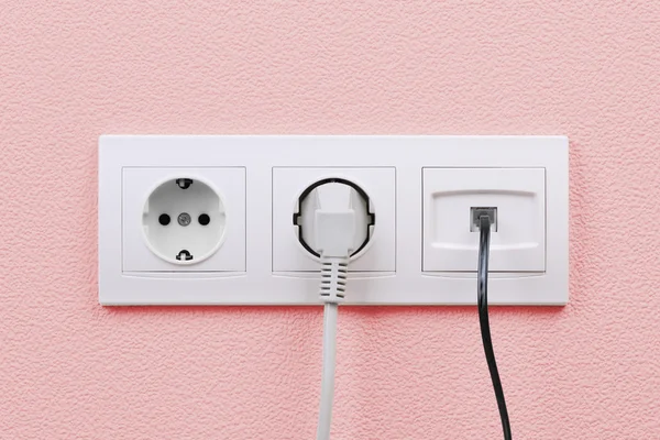 Electric and internet outlets on wall — Stock Photo, Image