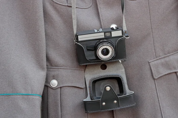 Old camera and a military jacket — Stock Photo, Image