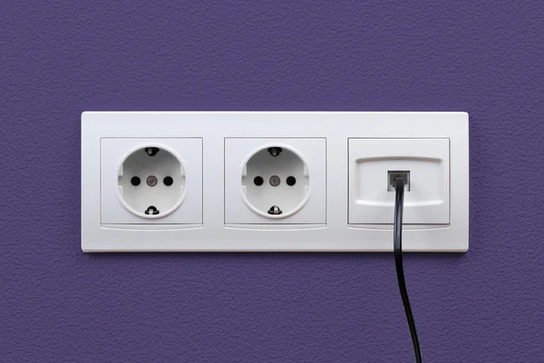 Electric and internet outlets on wall — Stock Photo, Image