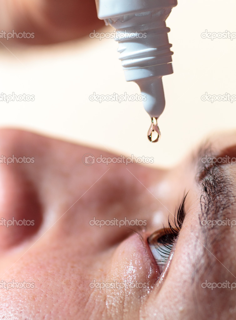 Man applying eyedrops
