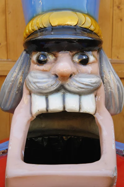 Giant head of nutcracker figure, sculpture with wide open mouth