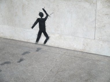 Artwork painting on grey stone, man running through stone wall clipart
