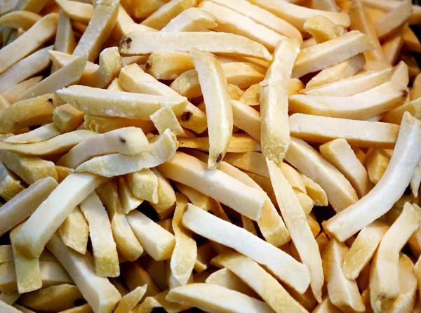 Raw, uncooked potato chips, sticks (french fries) Stock Image